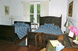 Waipio Wayside, Plantation Room, two bed and a table